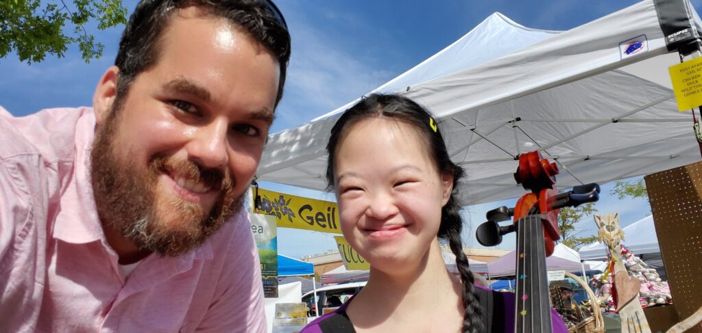 Sam with a student who takes private cello lessons